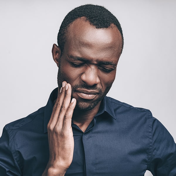 A man having a jaw pain